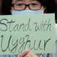 A man holds a sign during a rally to show support for Uighurs and their fight for human rights in Hong Kong, Sunday, Dec. 22, 2019.